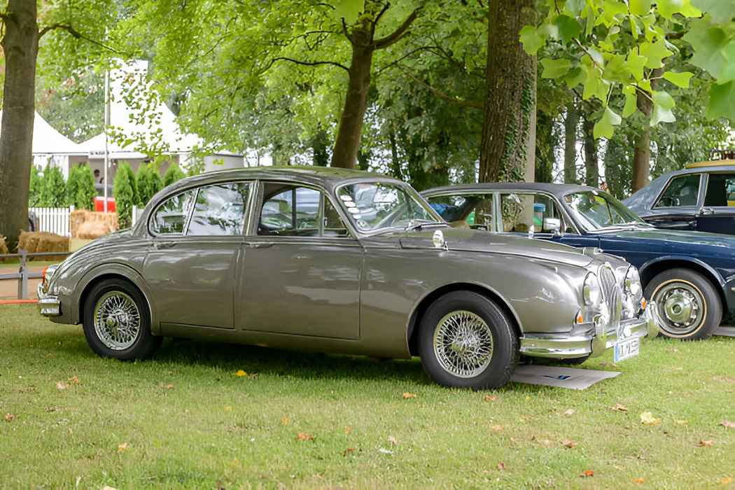 Jaguar MK2 classic luxury car parked on a scenic road