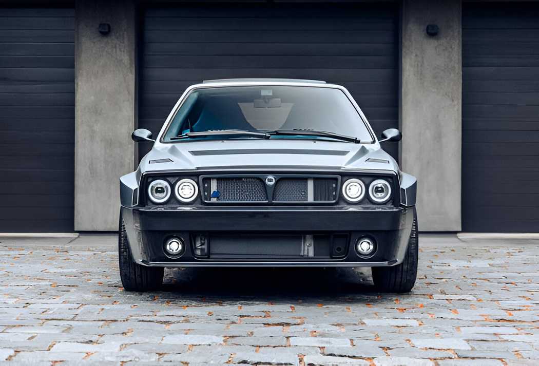 Lancia Delta Integrale parked on a scenic road.