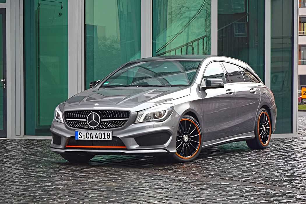 Mercedes-Benz CLA parked on a scenic road, showcasing its sleek design and luxury features.